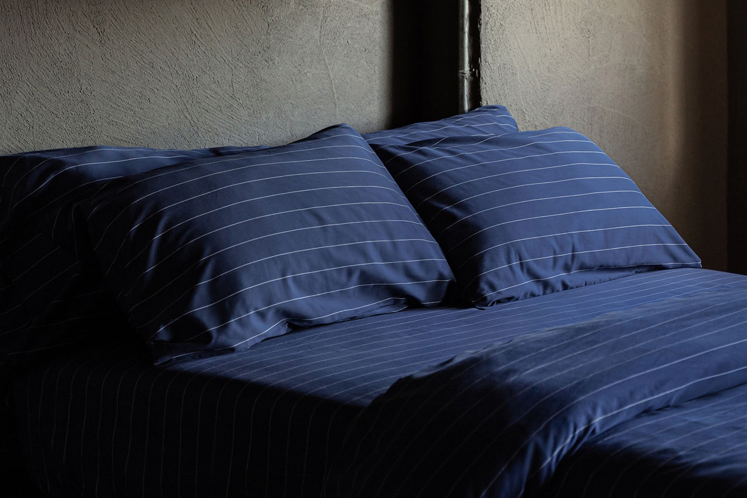 classic-navy-pinstripes-pillowcase-pair-hero-shot-by-sojao.jpg