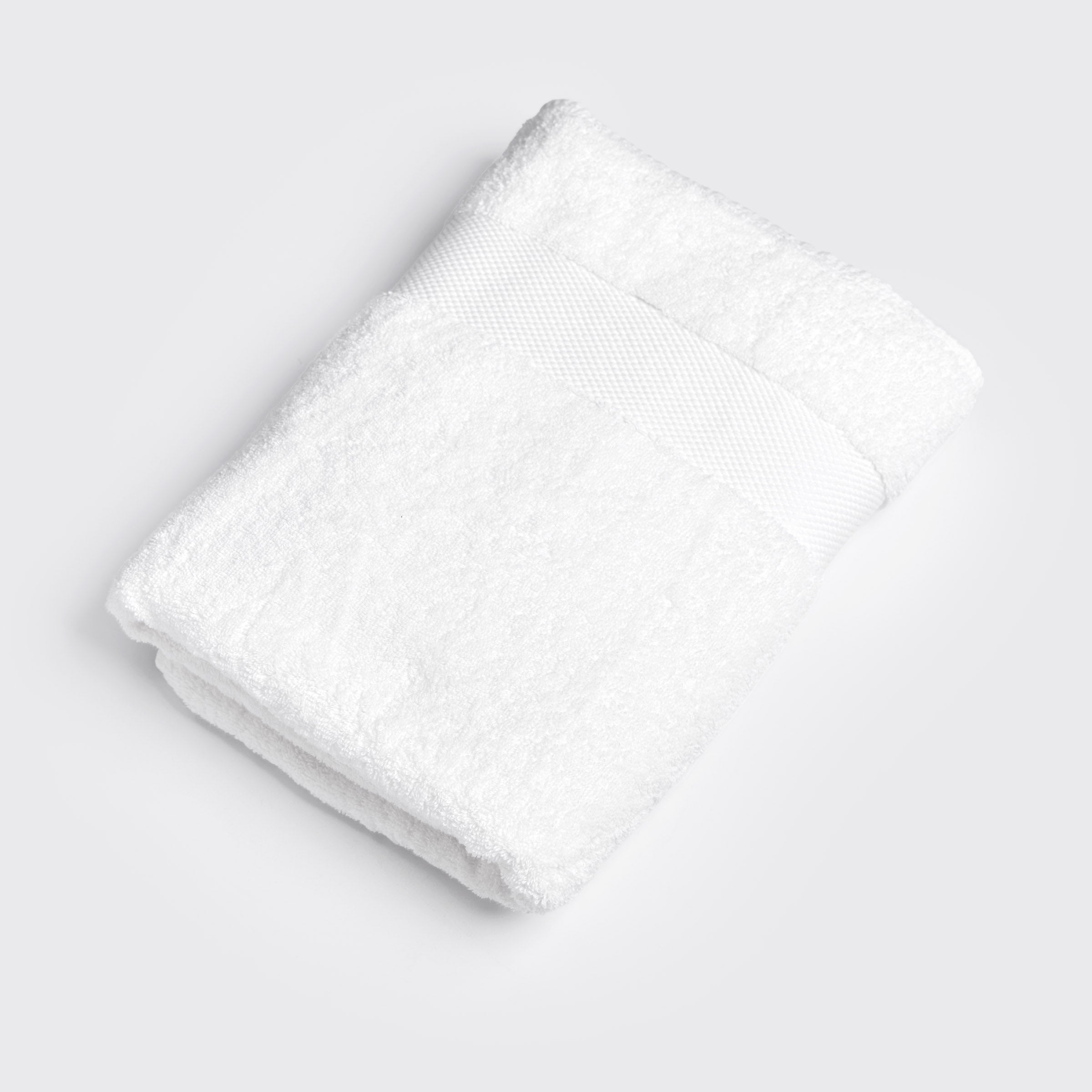 organic-cotton-hand-towel-in-white-colour-folded-by-sojao