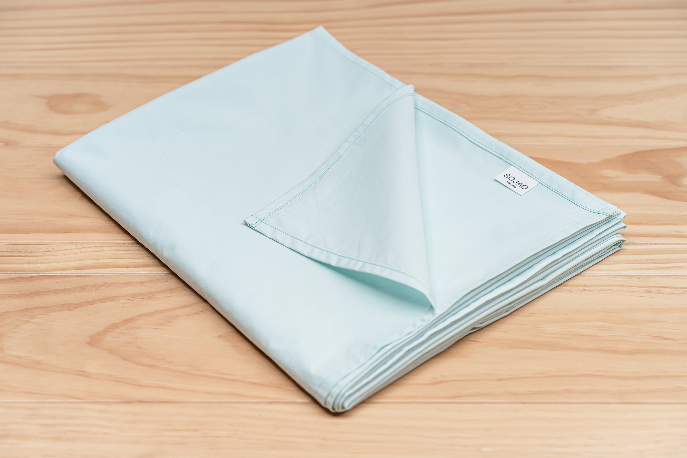 crisp-mint-organic-cotton-table-cloth-folded-by-sojao.jpg
