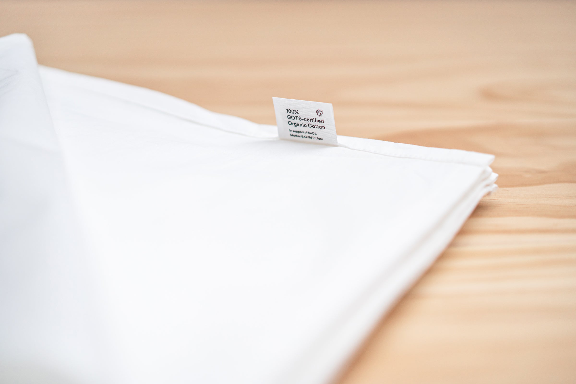 crisp-white-organic-cotton-table-cloth-label-tag-shot-by-sojao.jpg
