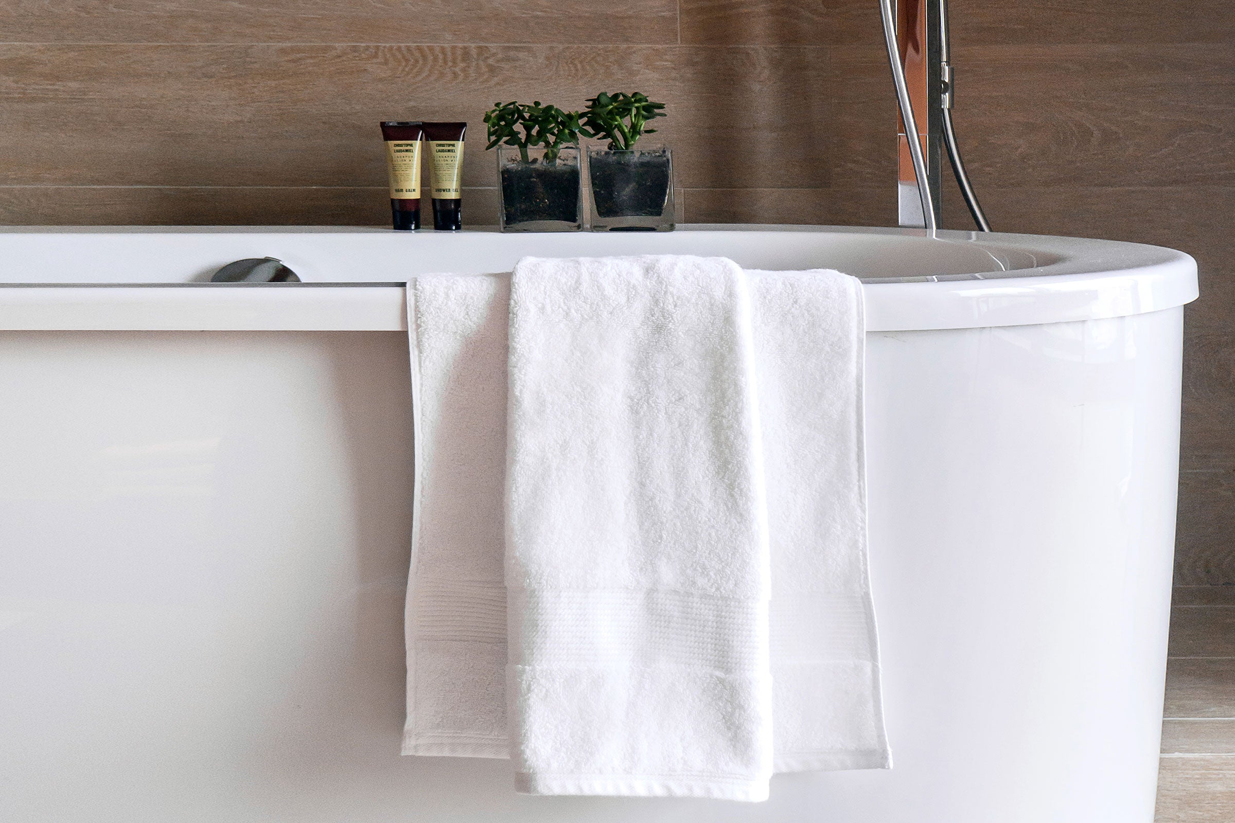 white-organic-bath-towel-on-bathtub-by-sojao.jpg