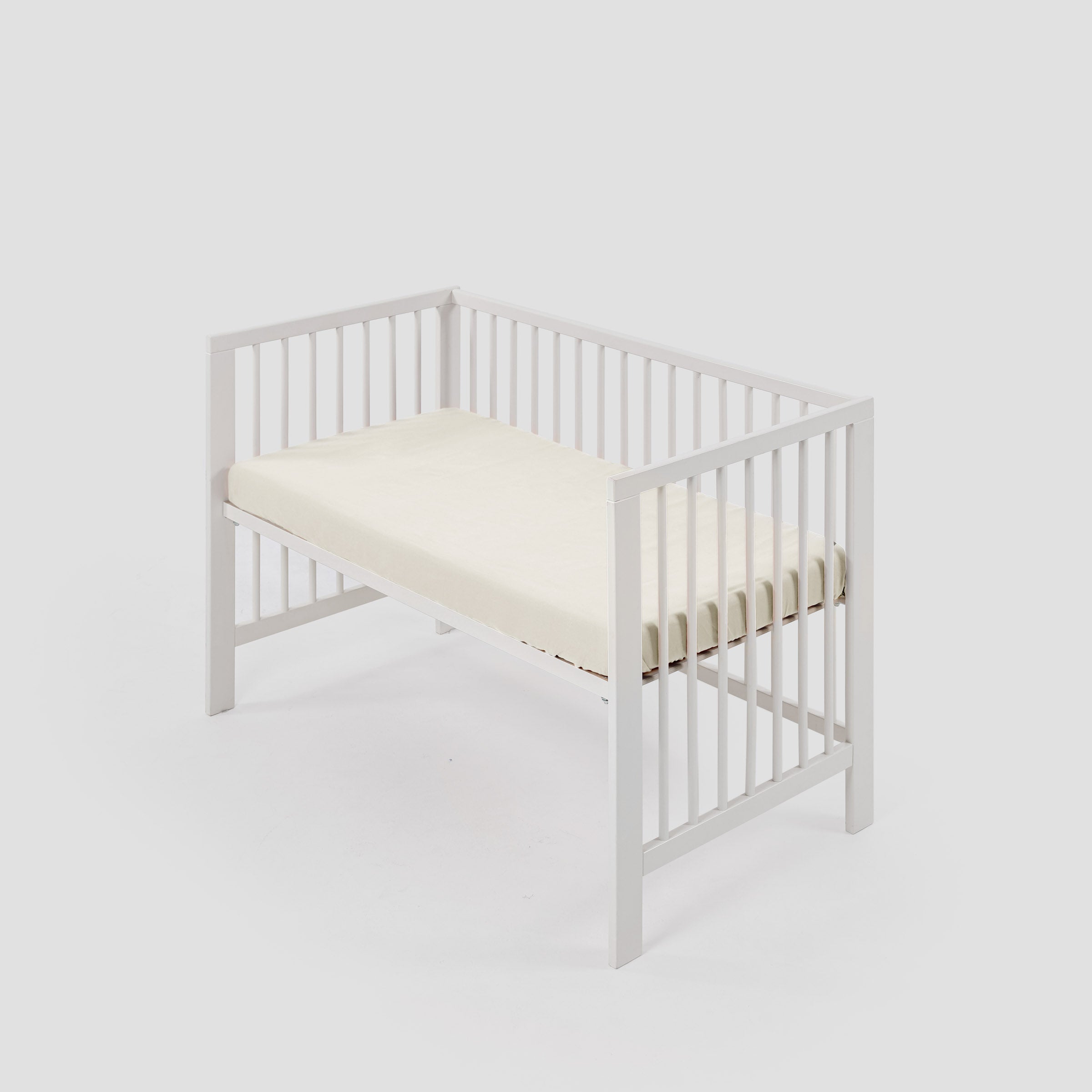 organic-classic-baby-cot-fitted-sheet-in-natural-colour-within-a-cot-by-sojao