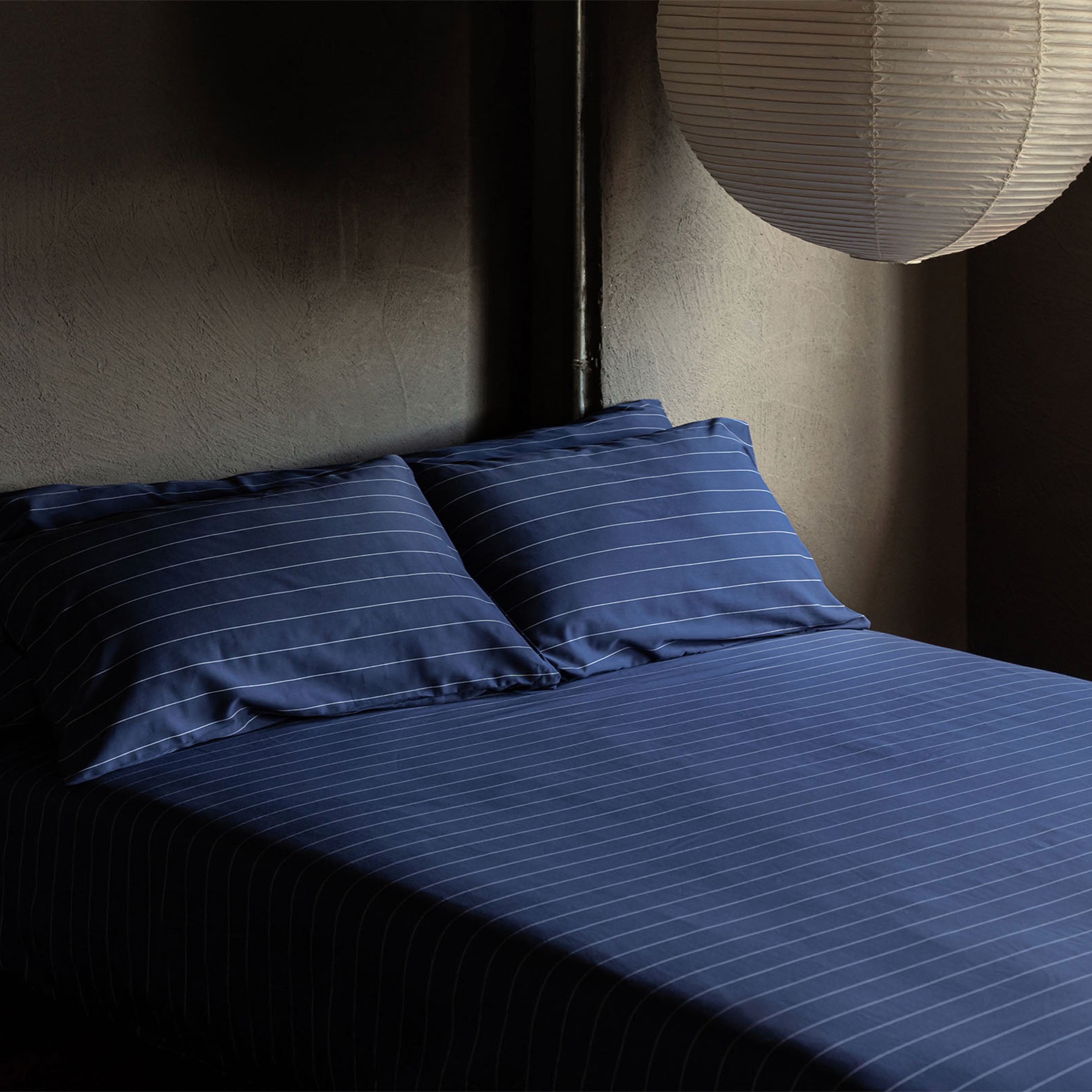 classic-navy-pinstripes-sheet-set-in-bedroom-by-sojao