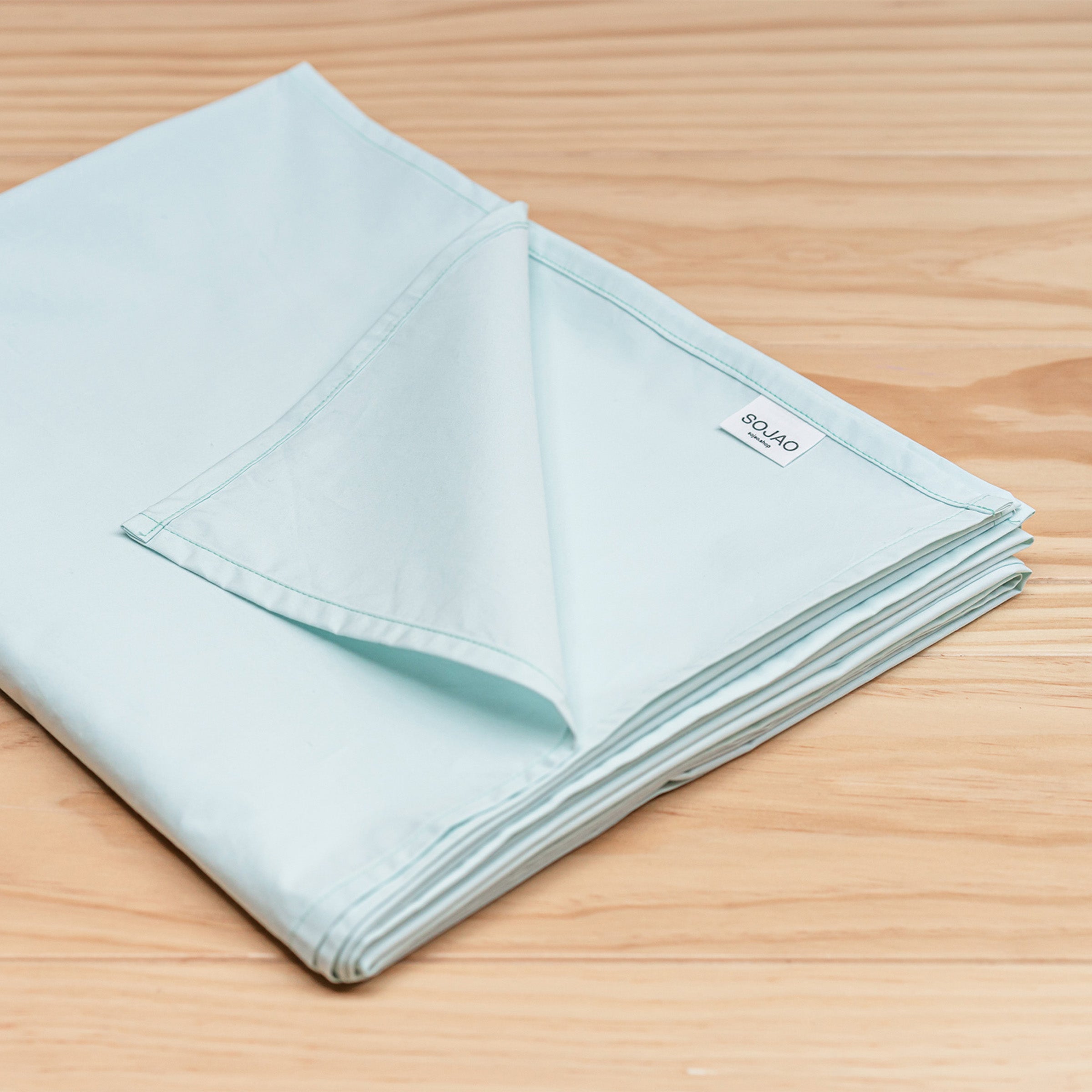 organic-cotton-crisp-table-cloth-in-mint-colour-folded-by-sojao