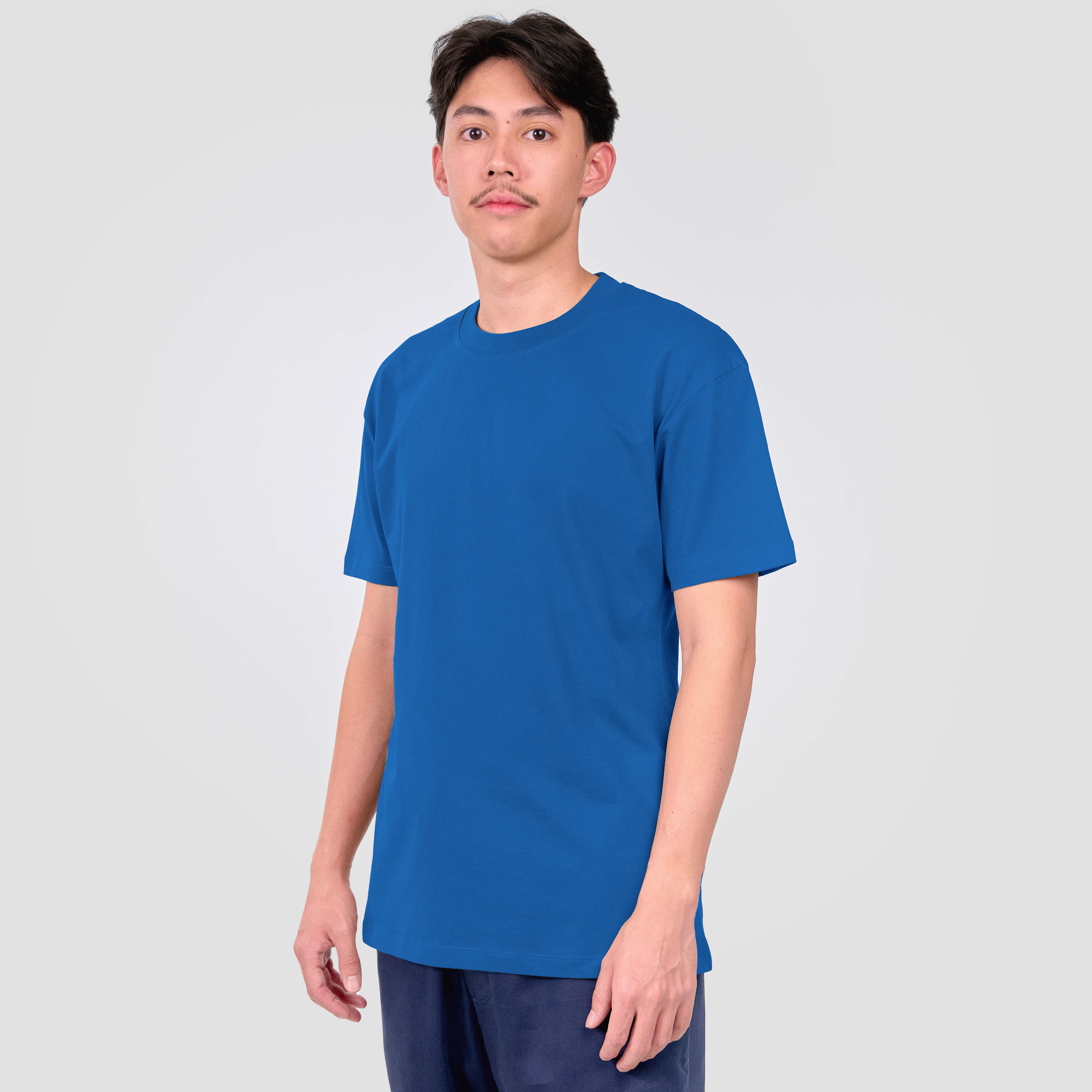 Person wearing a blue t-shirt against a white background