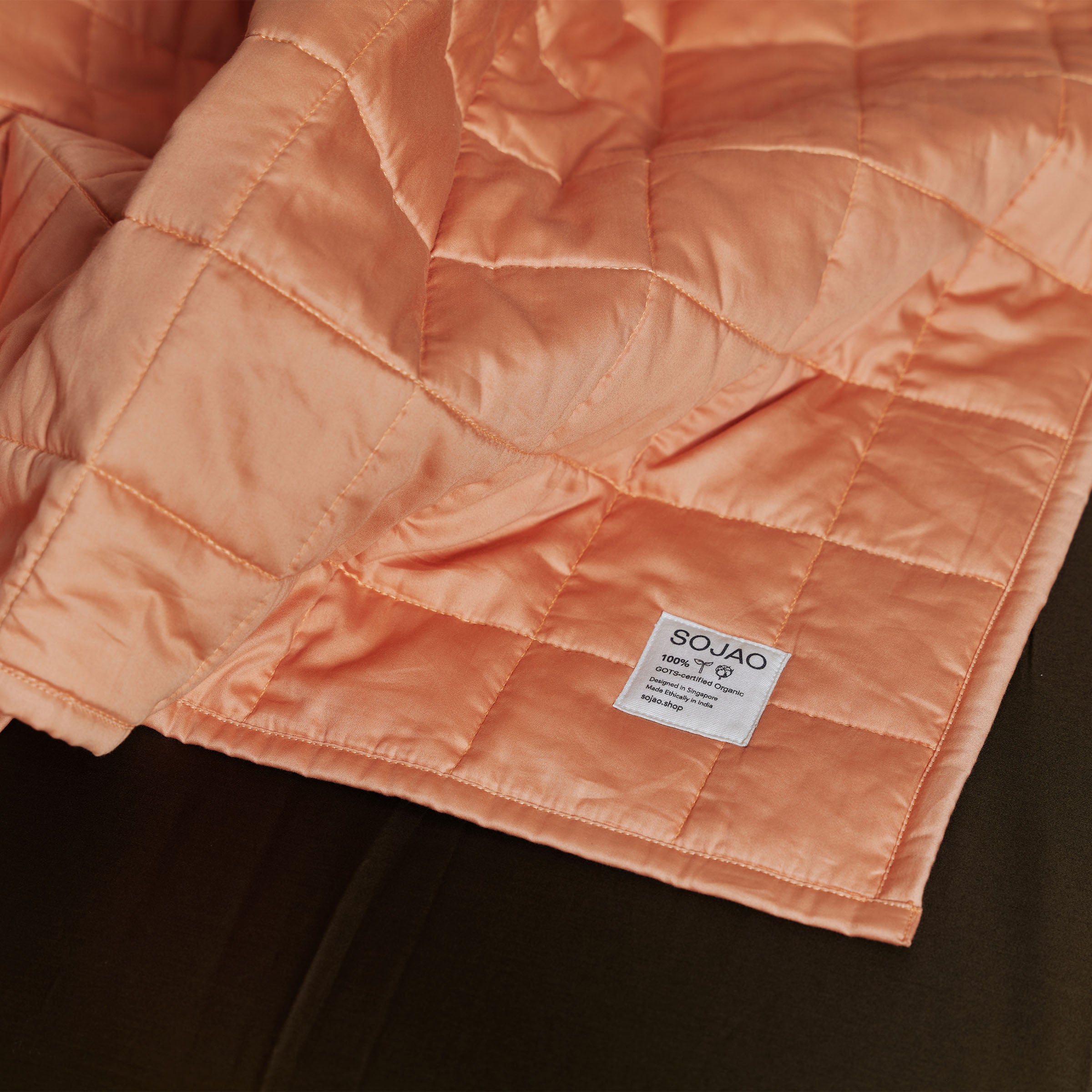 organic-cotton-quilt-in-peach-colour-inside-bedroom-by-sojao