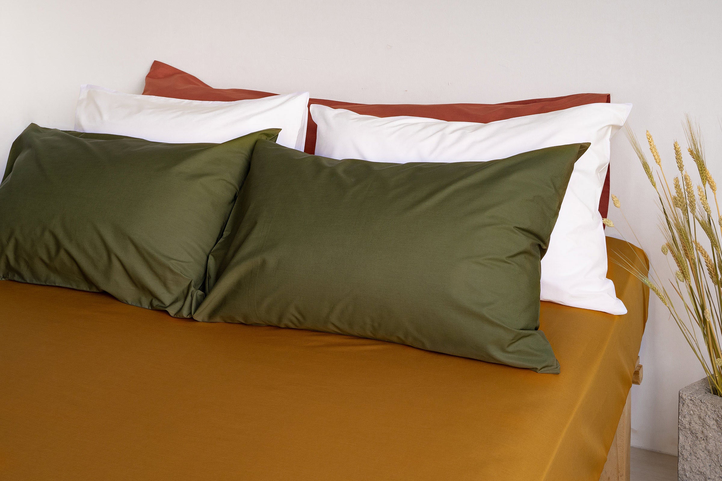 crisp-mustard-fitted-sheet-olive-white-pillowcase-pair-clay-body-pillow-by-sojao.jpg