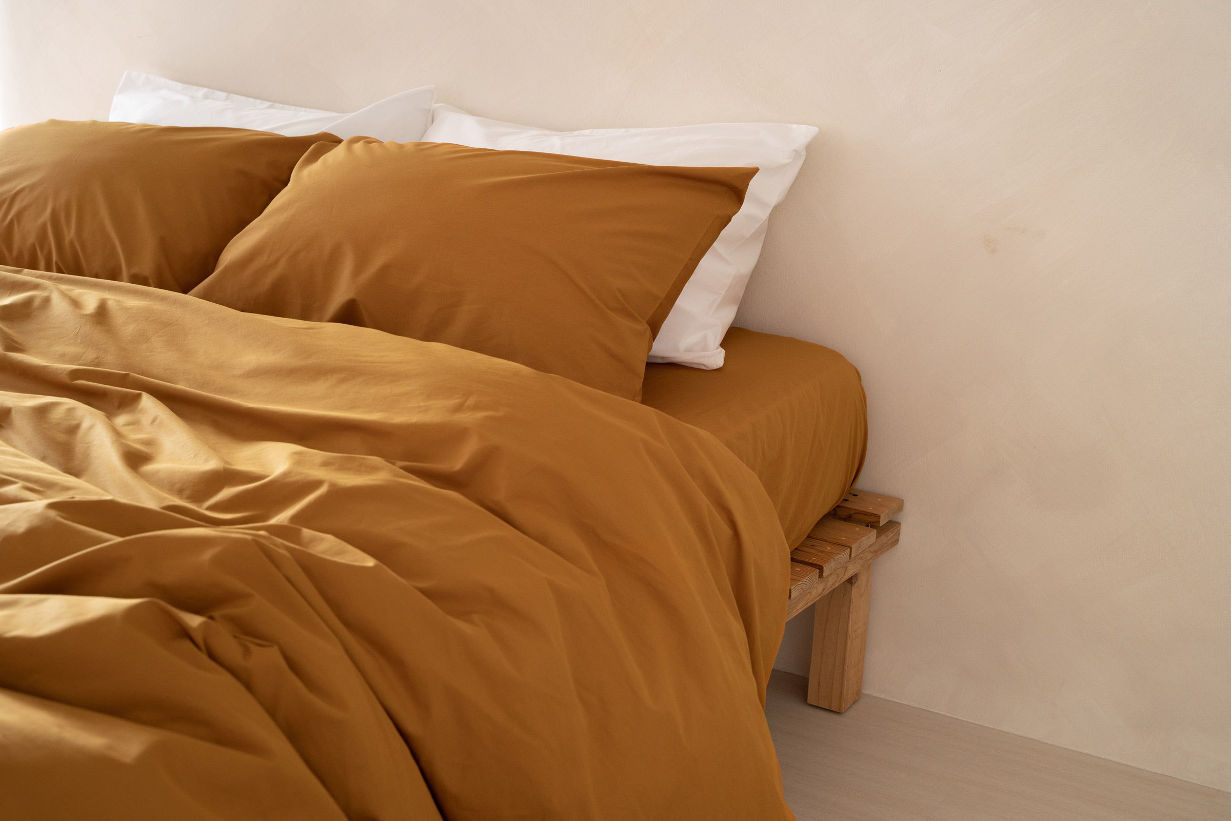 crisp-mustard-duvet-cover-fitted-sheet-pillowcase-pair-white-pillowcase-pair-side-view-by-sojao.jpg