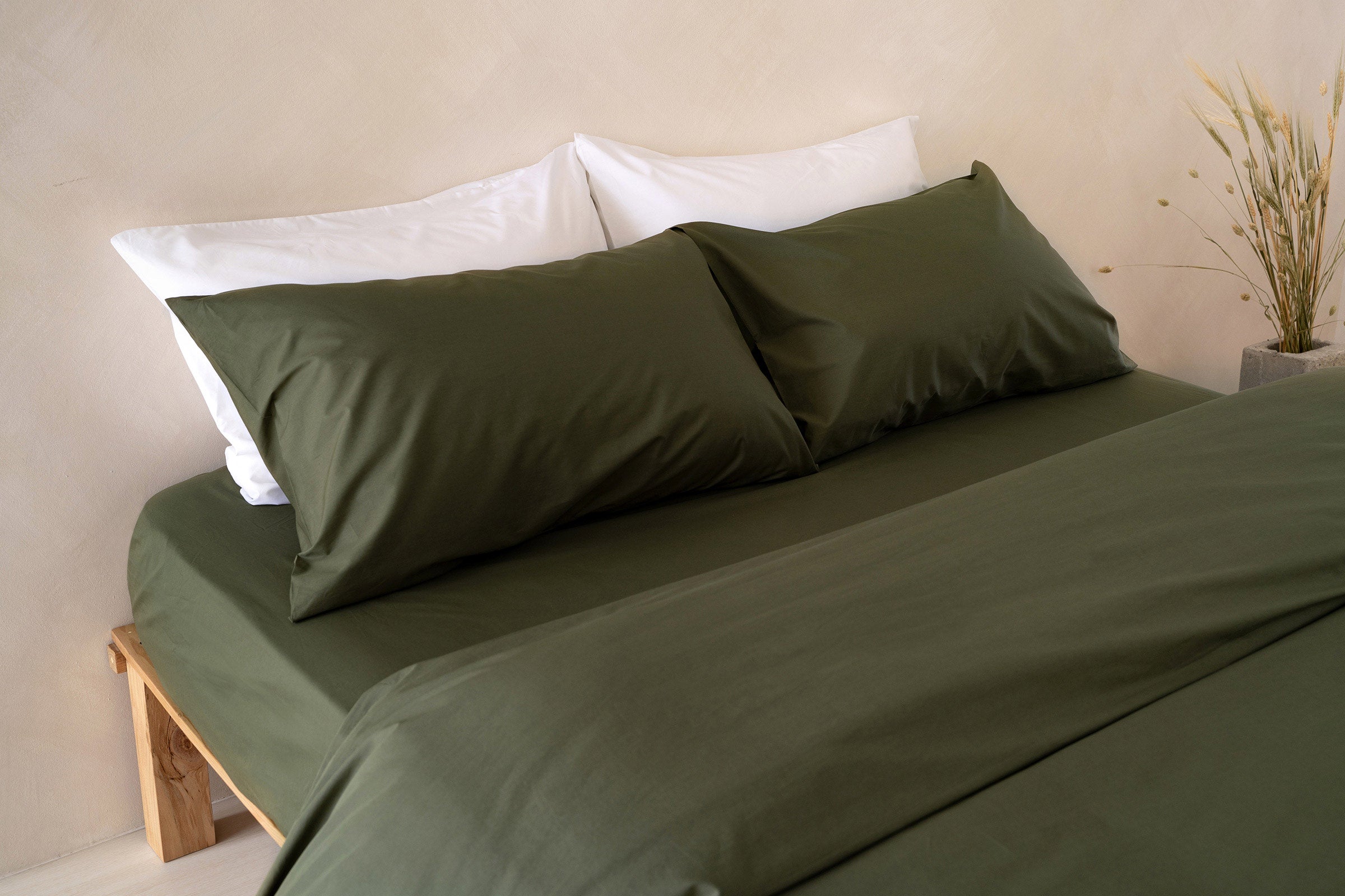 crisp-olive-fitted-sheet-duvet-cover-pillowcase-pair-white-pillowcase-pair-side-view-by-sojao.jpg