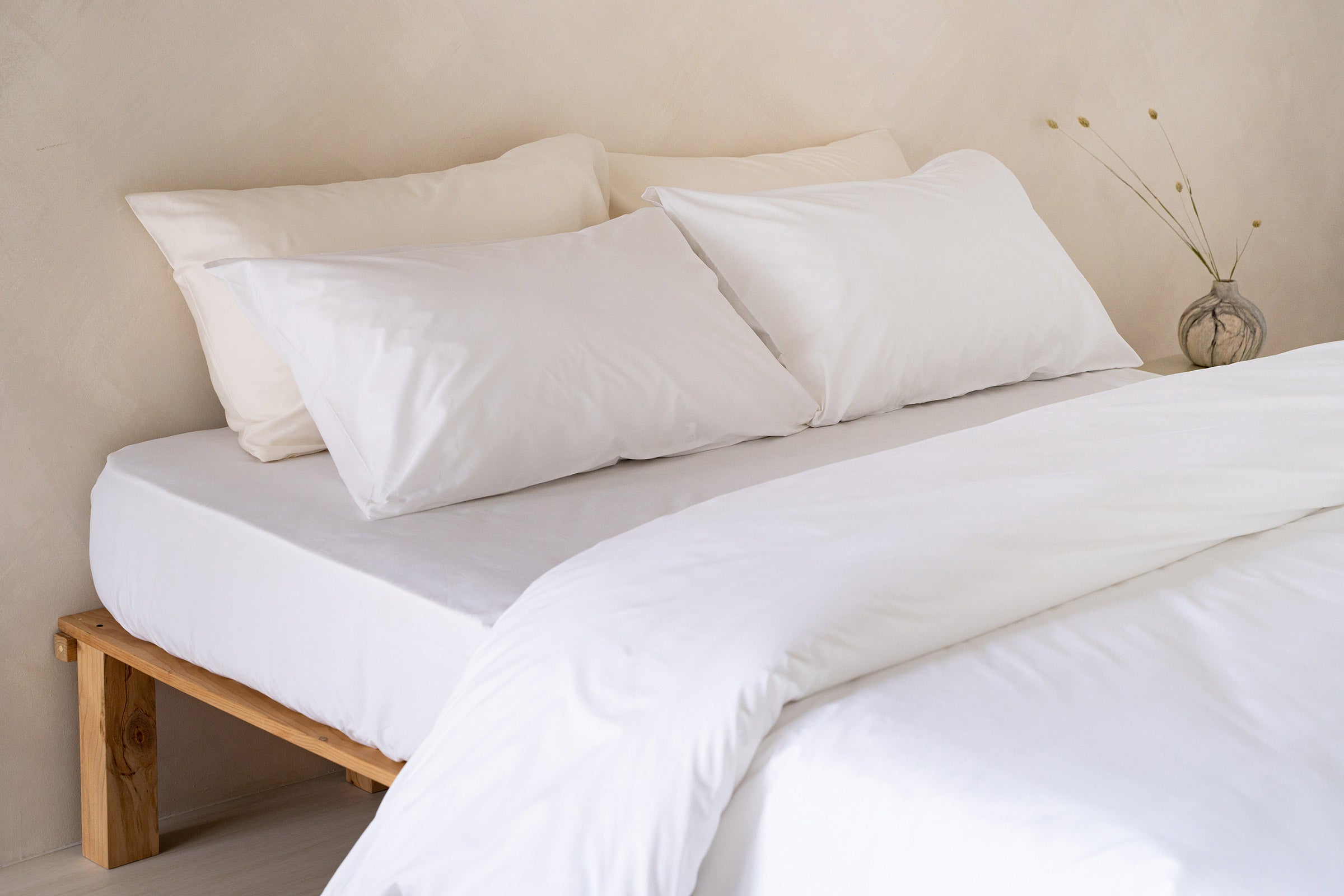 crisp-white-duvet-cover-fitted-sheet-pillowcase-pair-natural-pillowcase-pair-side-view-by-sojao.jpg