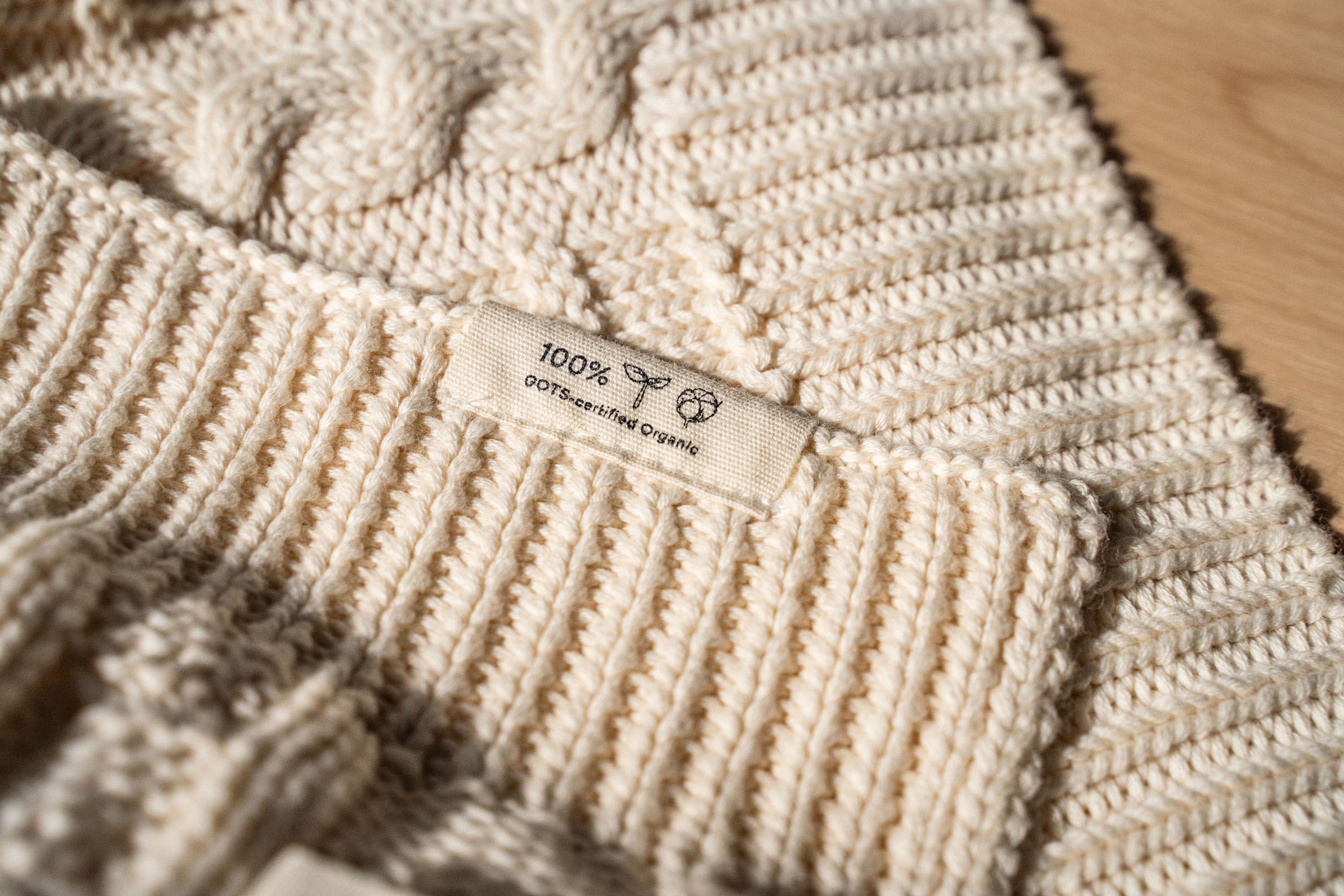 ivory-cable-knit-throw-tag-close-up-shot-by-sojao