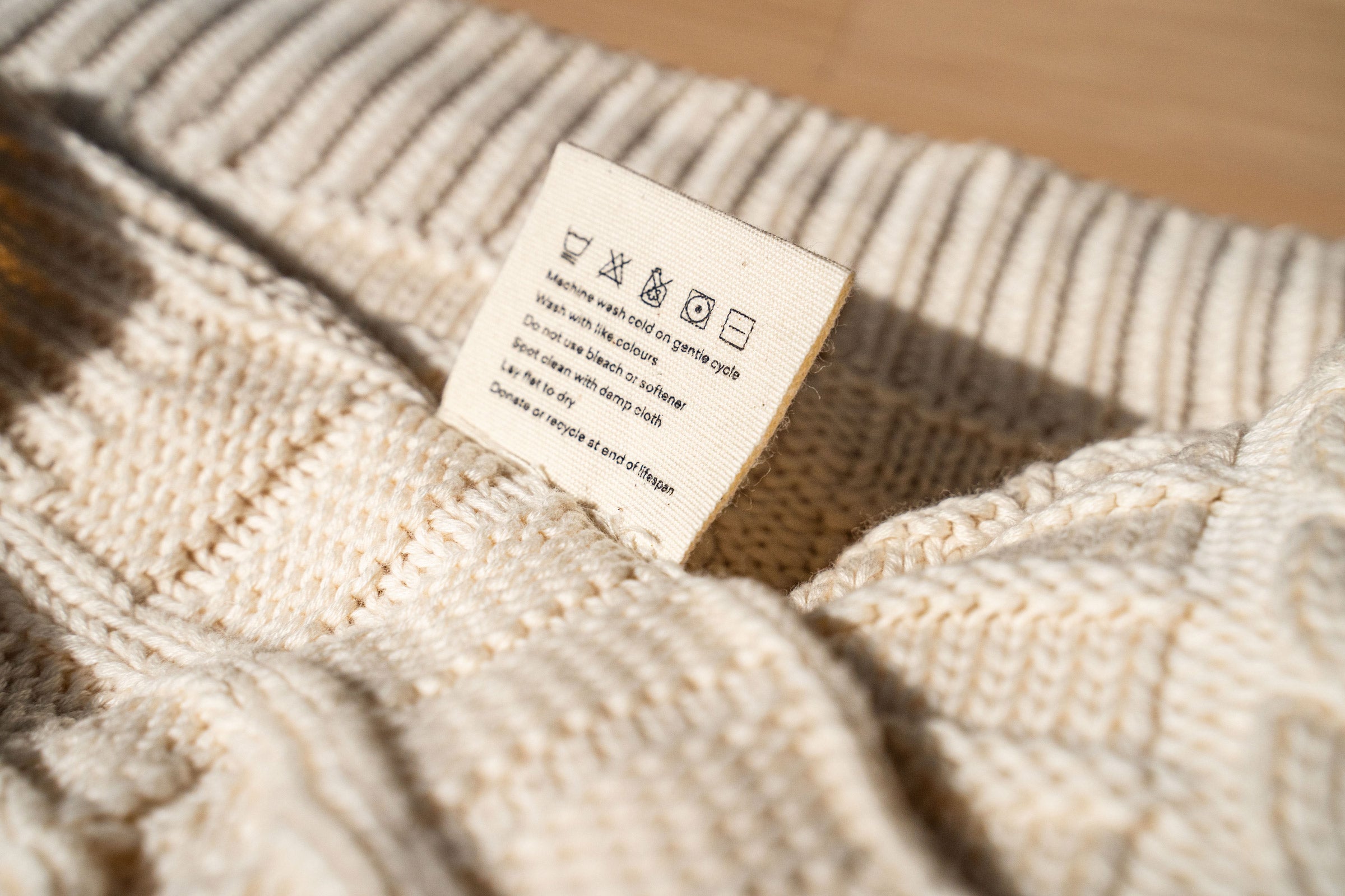 ivory-cable-knit-throw-wash-care-tag-close-up-shot-by-sojao