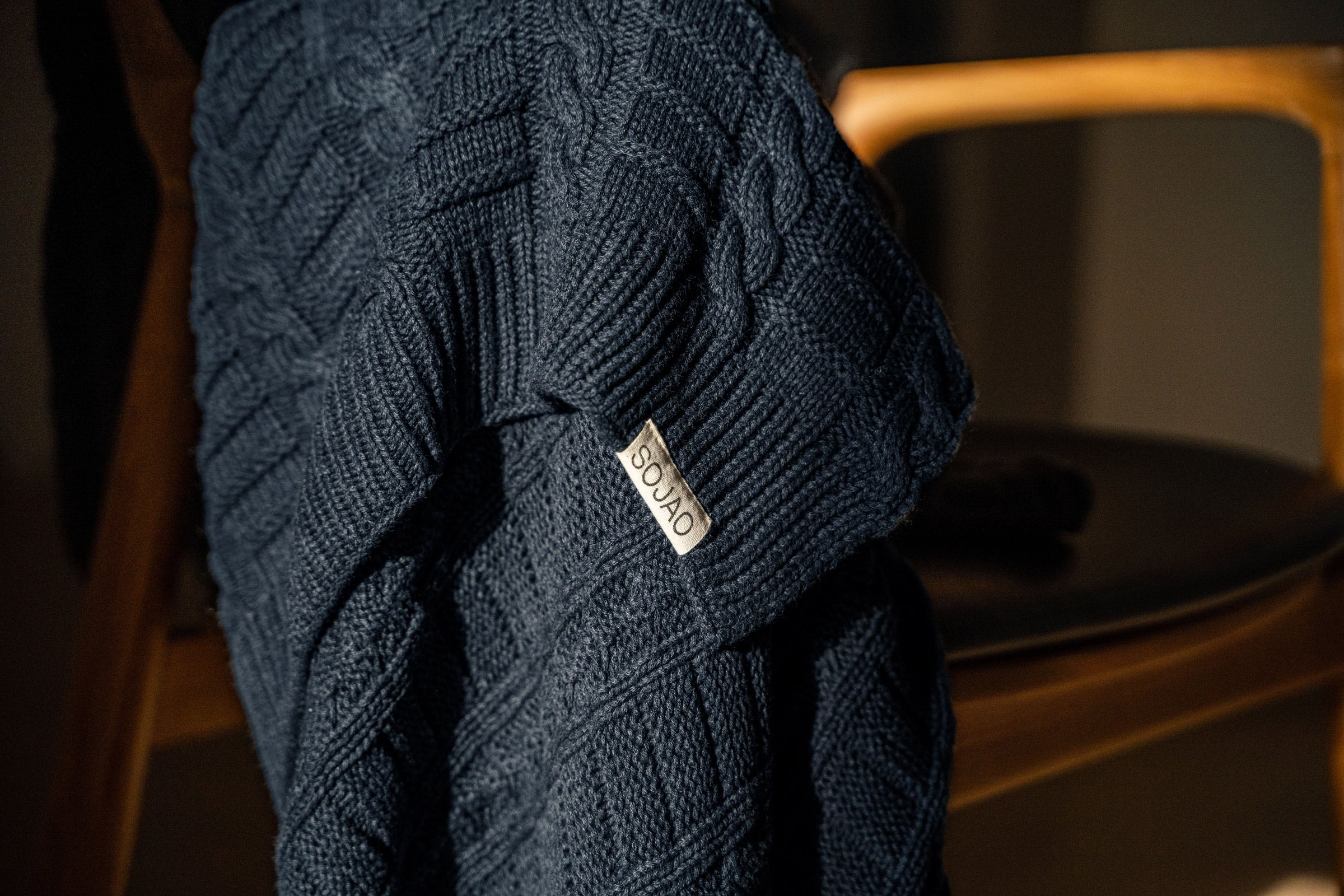 navy-cable-knit-throw-mid-close-up-shot-by-sojao