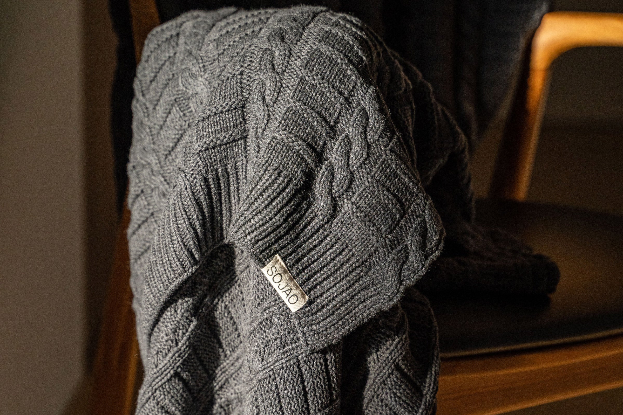 stone-cable-knit-throw-mid-close-up-shot-by-sojao
