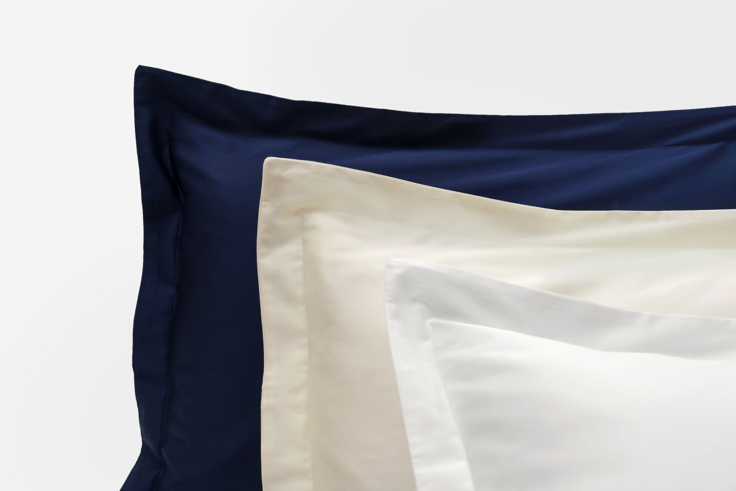 classic-navy-natural-white-oxford-pillowcase-pair-close-up-shot-by-sojao.jpg