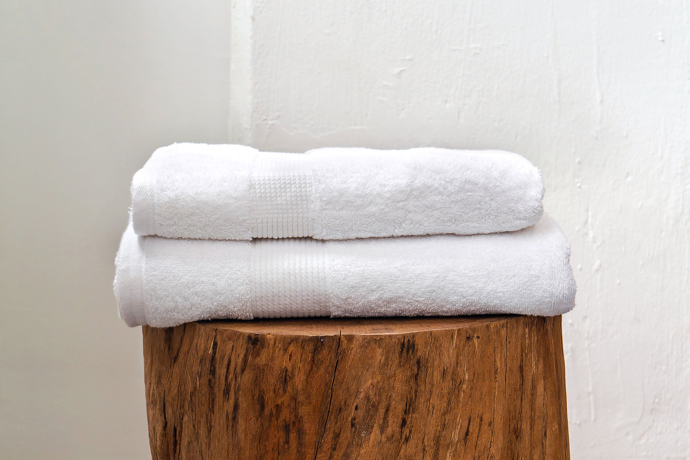 white-organic-bath-towel-on-stump-by-sojao.jpg